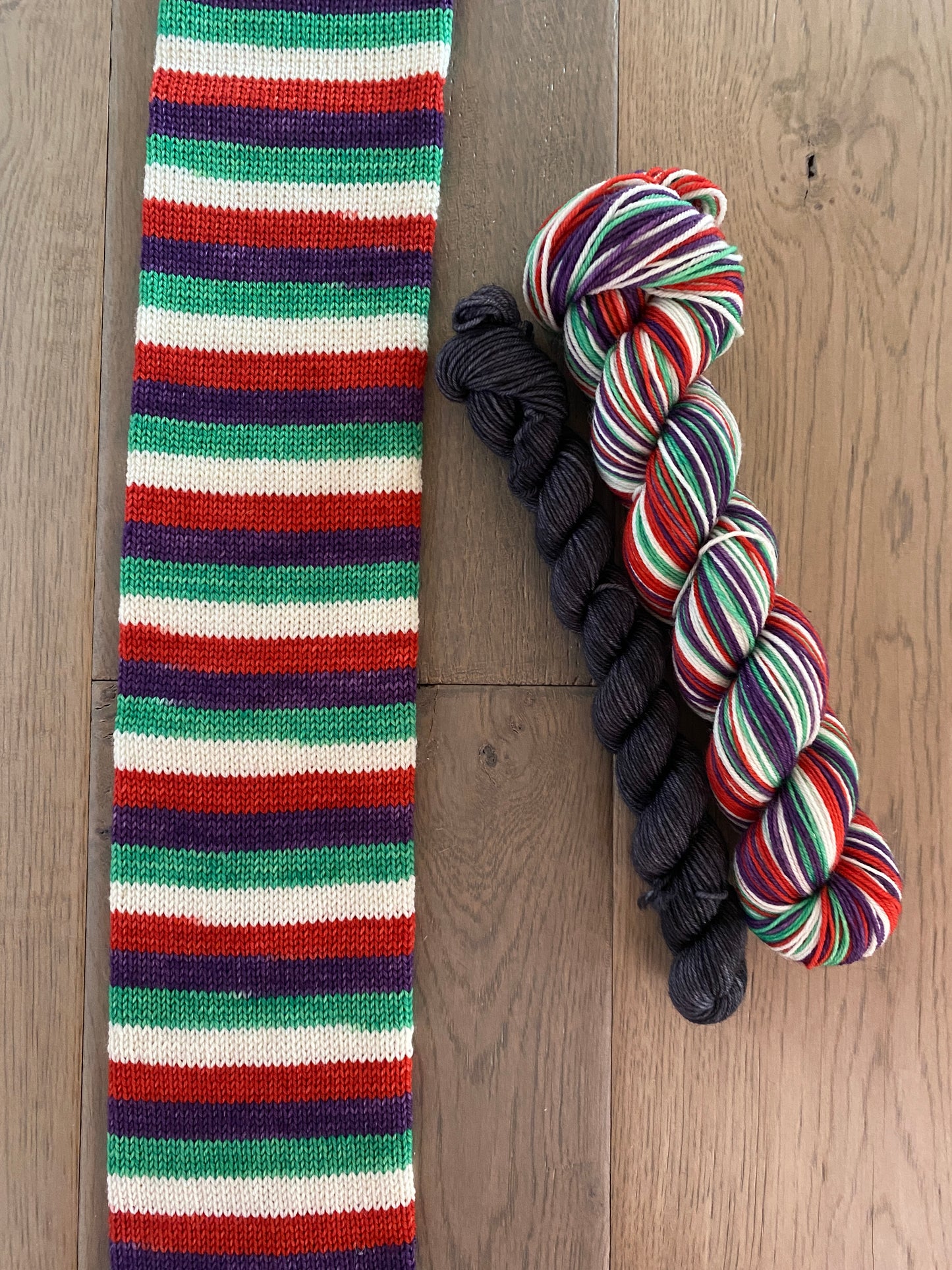 Superhero Inspired “Jack Oswald White” Fingering Self-Striping Sock Set