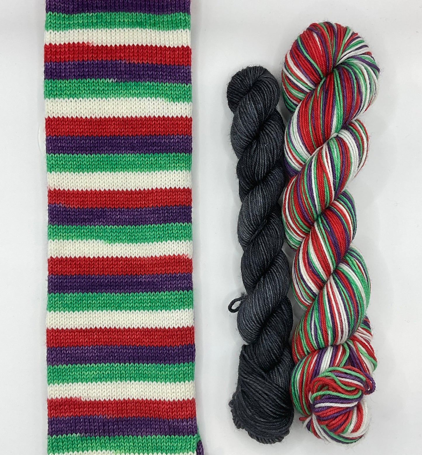 Superhero Inspired “Jack Oswald White” Fingering Self-Striping Sock Set